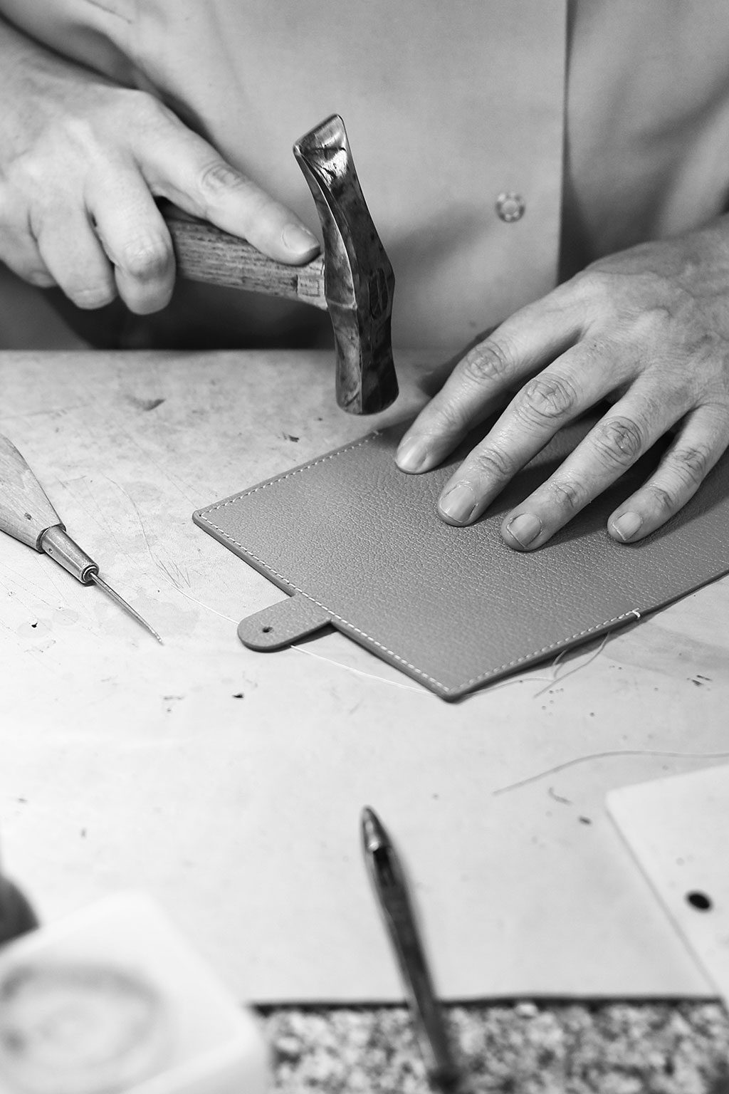 Hand Of A Craftsman While Shaping Leather Stock Photo, Picture and Royalty  Free Image. Image 23903146.